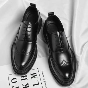 a pair of black leather shoes for gentle men