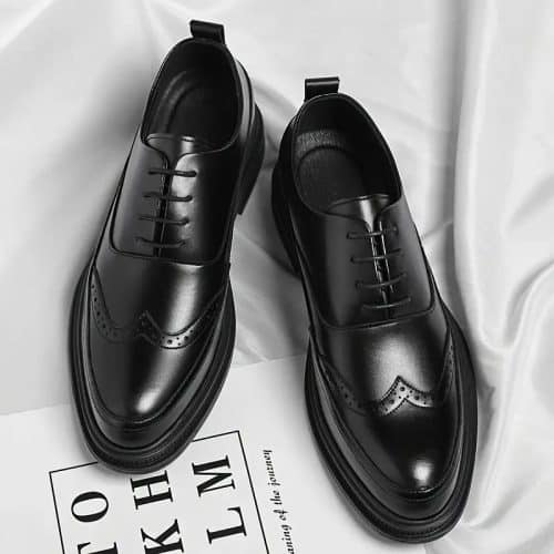 a pair of black leather shoes for gentle men