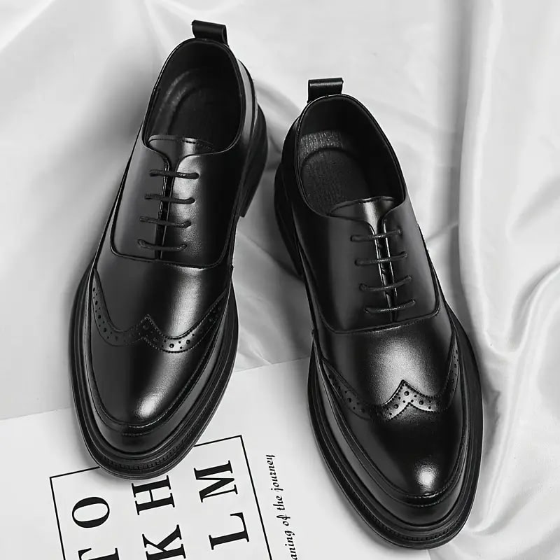 a pair of black leather shoes for gentle men