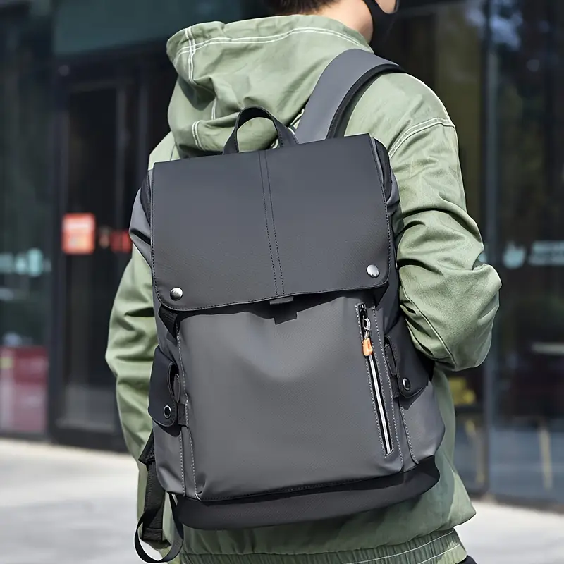 a black backpack with a zipper
